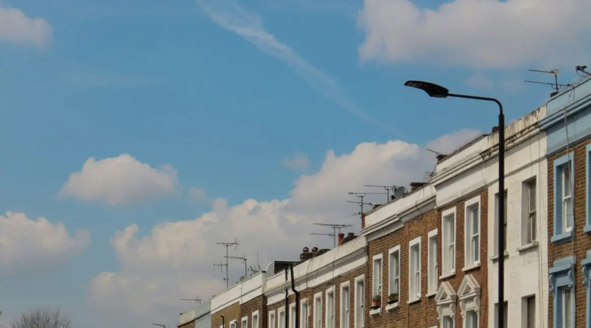 Islington townhouse street with buyers calculating borrowing with adviser