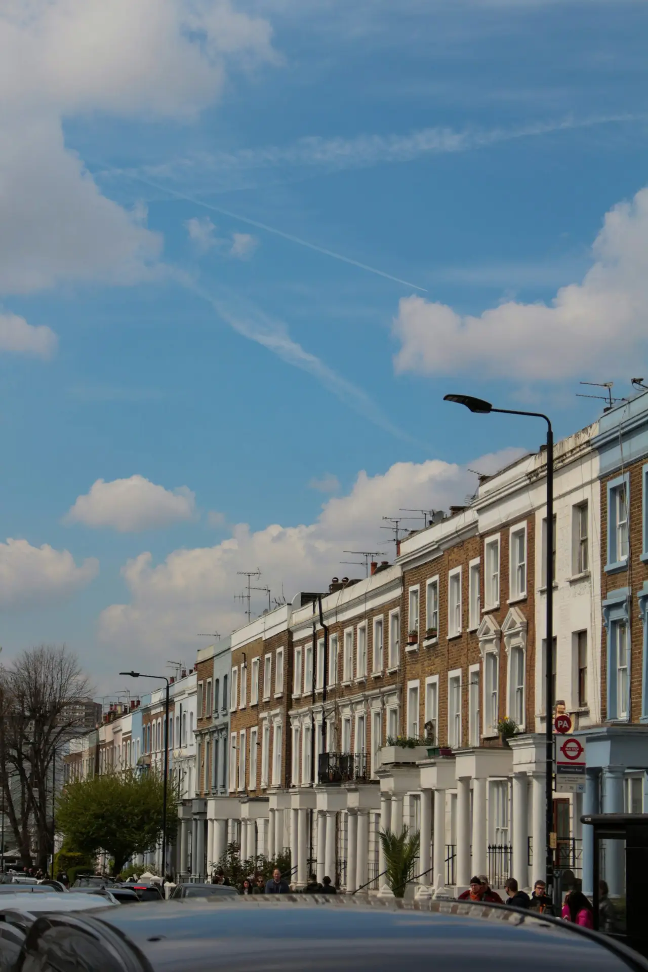 Islington townhouse street with buyers calculating borrowing with adviser